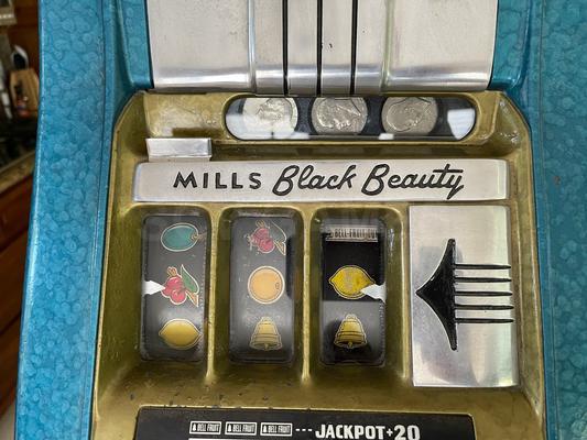 1940's Mills Black Beauty High Top Dollar Slot Machine Image