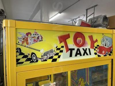 2010 Betson Enterprises Toy Taxi Claw Machine Image